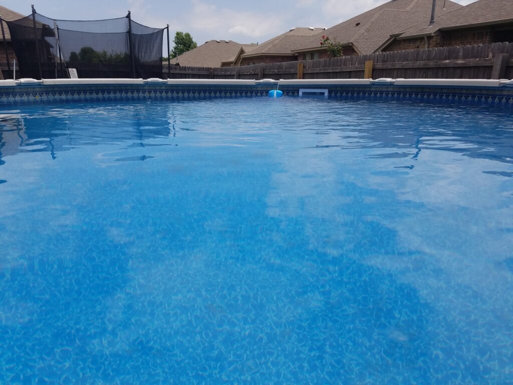 A clean residential pool in a backyard in Oklahoma City